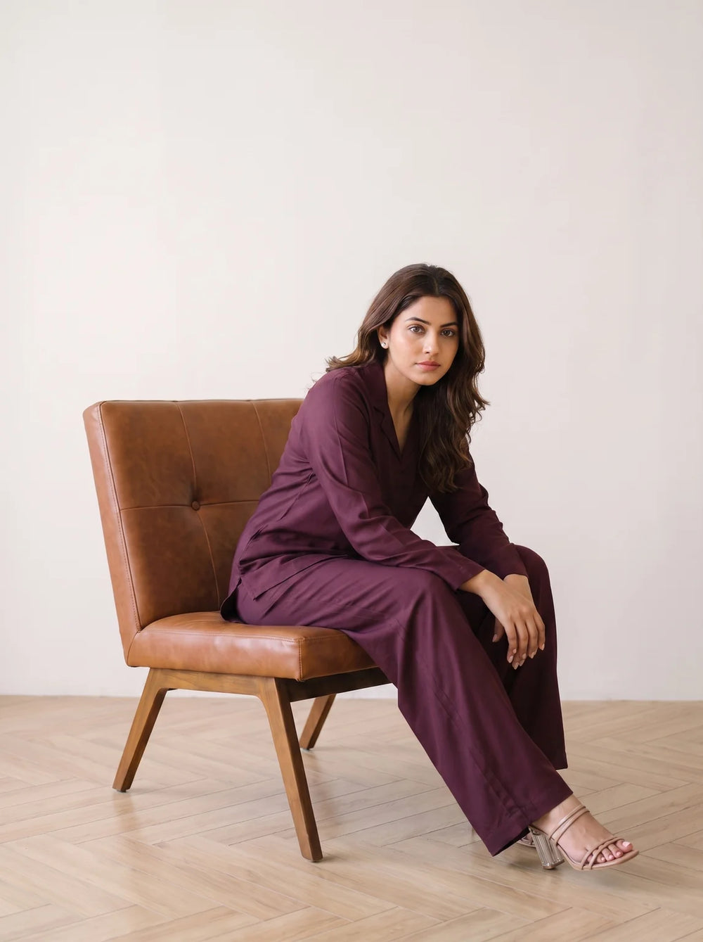 woman in wine solid viscose co ord set in a market lane