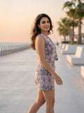 model wearing printed co-ord set by the sea at golden hour