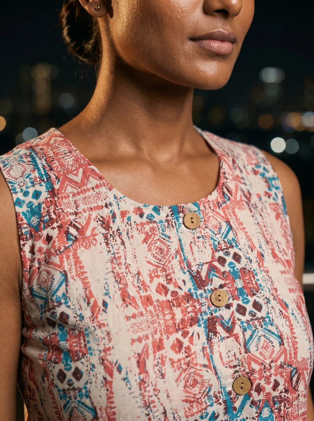 round neck wooden button placket and geometric print closeup
