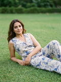 woman in blue abstract co ord set poolside evening