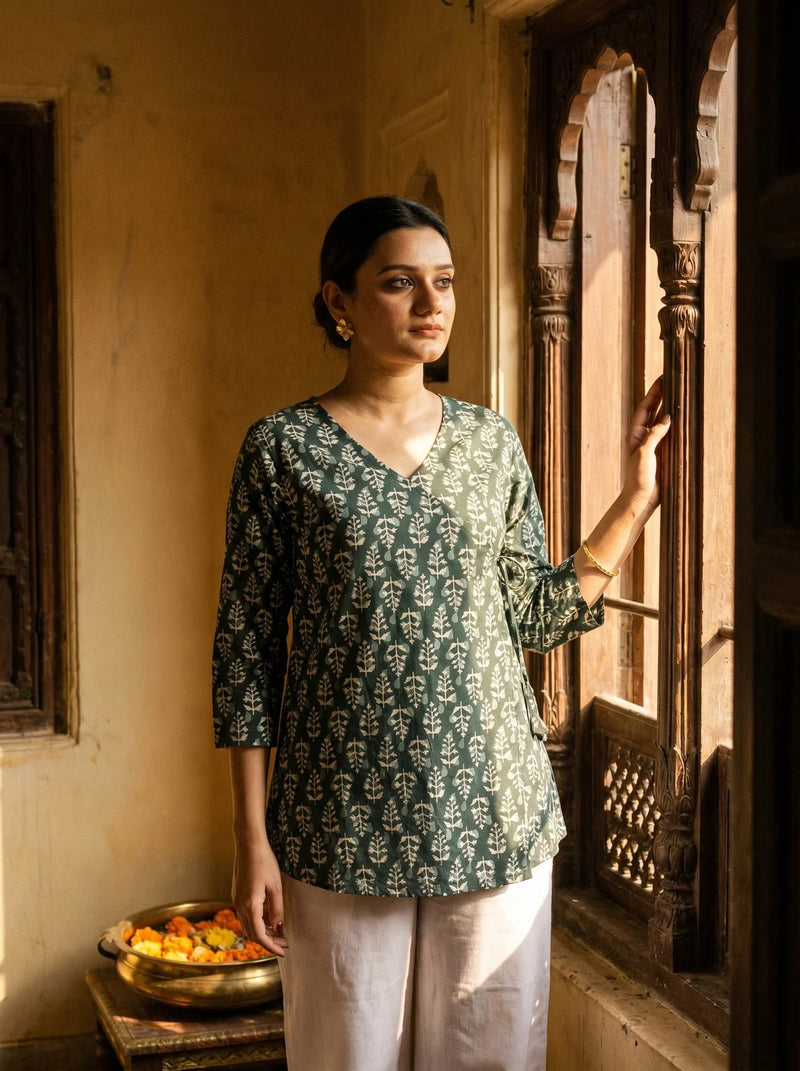 woman in bottle green botanical kurti at a heritage haveli