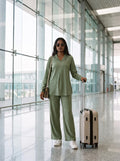 woman in sage green solid viscose co ord set by a shutter