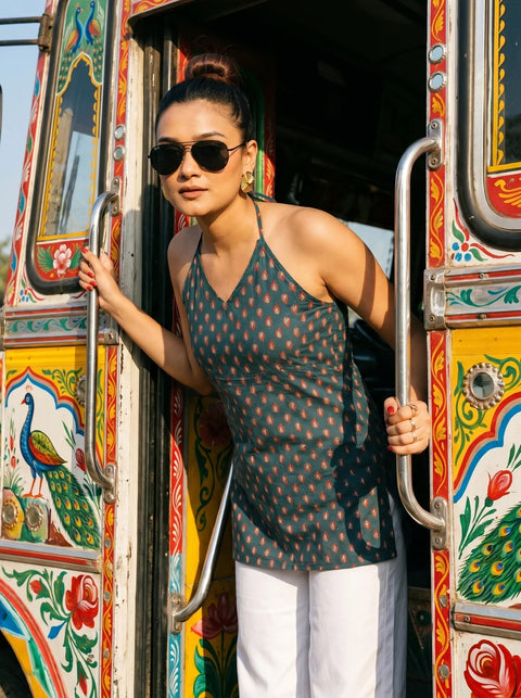 woman in teal halter kurti boarding a bus